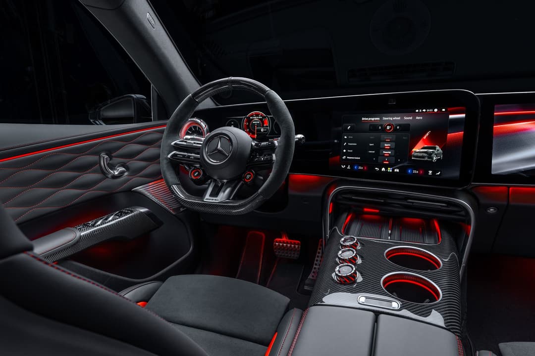 Mercedes-AMG GT SUV interior with three screens, red accents and AMG Performance seats