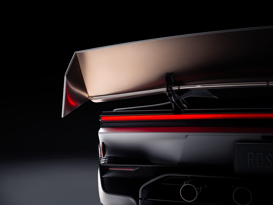 The Tesla Roadster's raised active rear wing above the red light bar