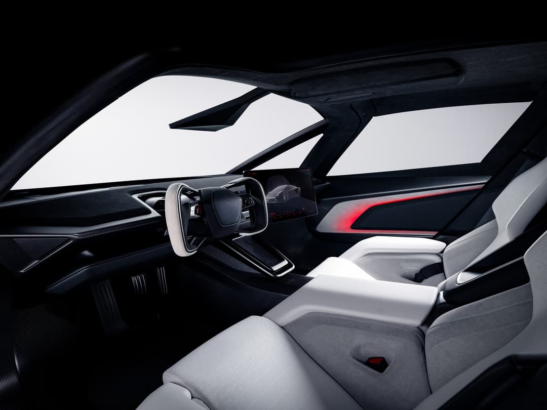 Tesla Roadster cockpit with steer-by-wire yoke-style wheel and wraparound glass
