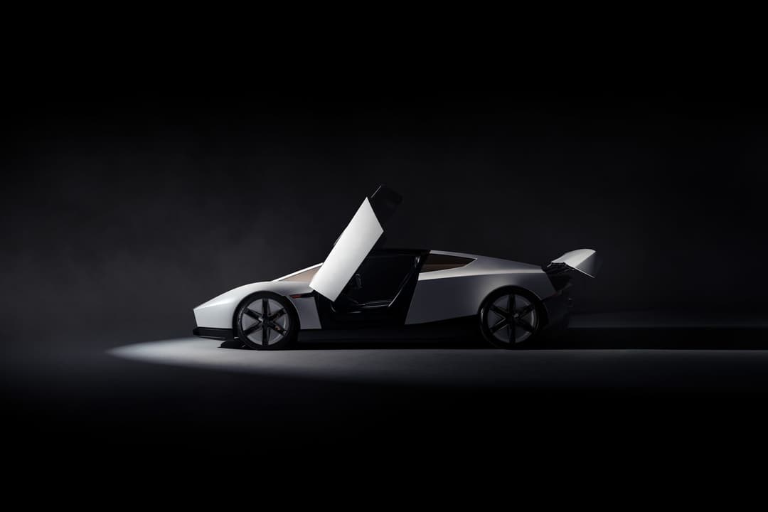 The new Tesla Roadster in profile with its scissor-style doors raised